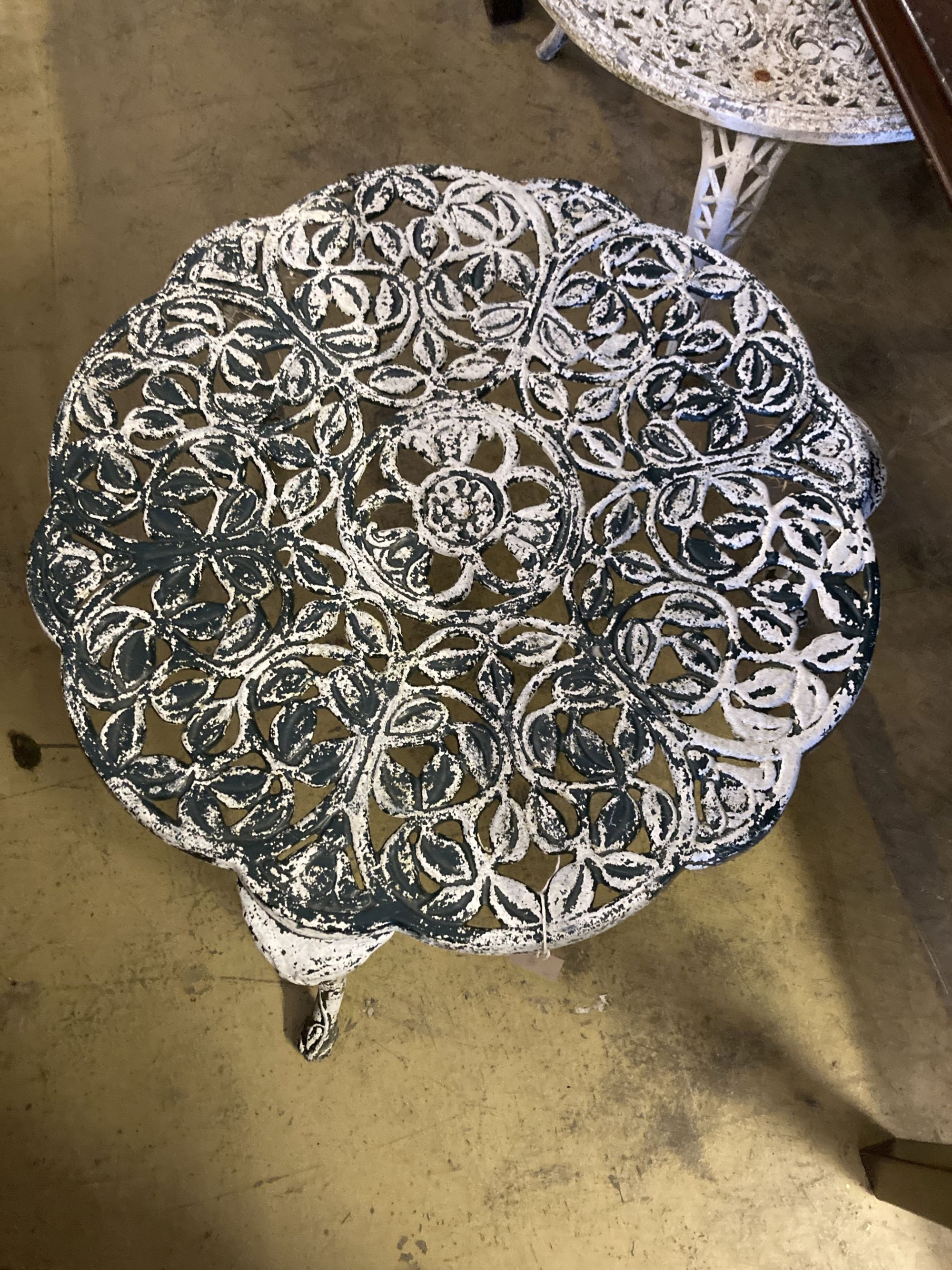 A pair of painted circular aluminium garden tables, larger 61cm diameter, height 44cm